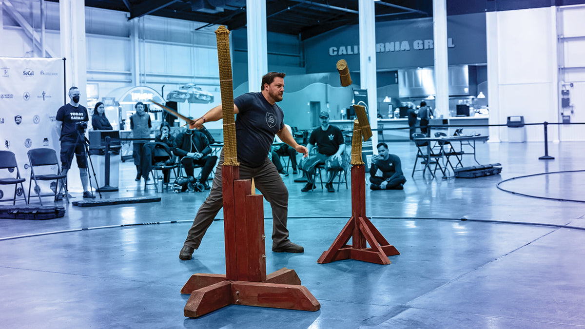 Chris Fields of Sterling Armory, executing the first double cut of the double double cut challenge at SoCal Swordfight, in the Tier A Arming Sword Cutting Finals